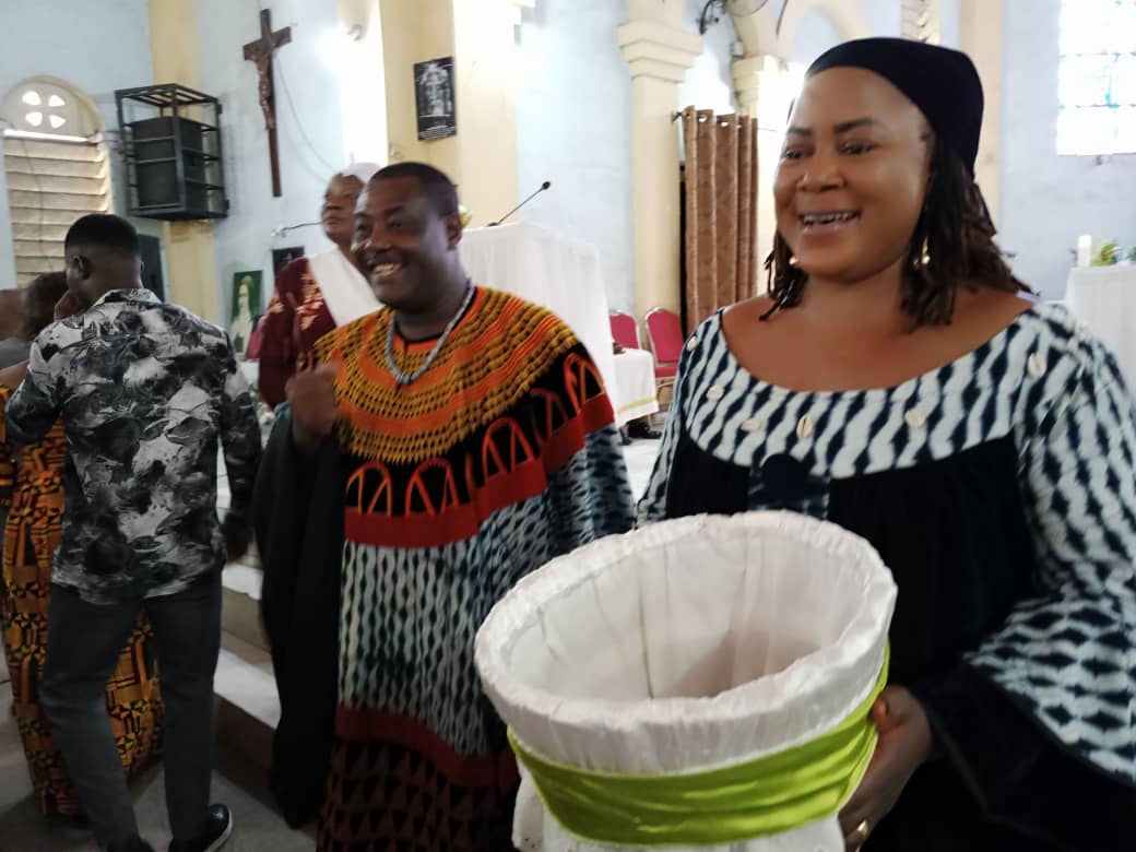 Mrs-Nchechuma-Banla-and-husband-during-special-offerings-at-the-Thanks-Giving-Mass.-Funds-collected-wil-go-to-assist-in-the-ongoing-new-Church-building-project.jpg